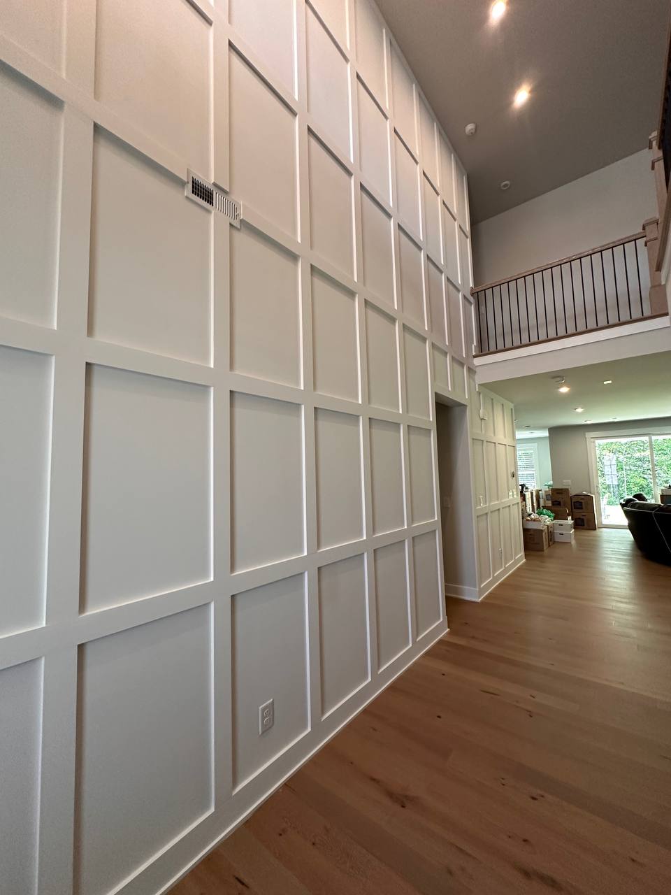 Full wall grid panel installation in open hallway